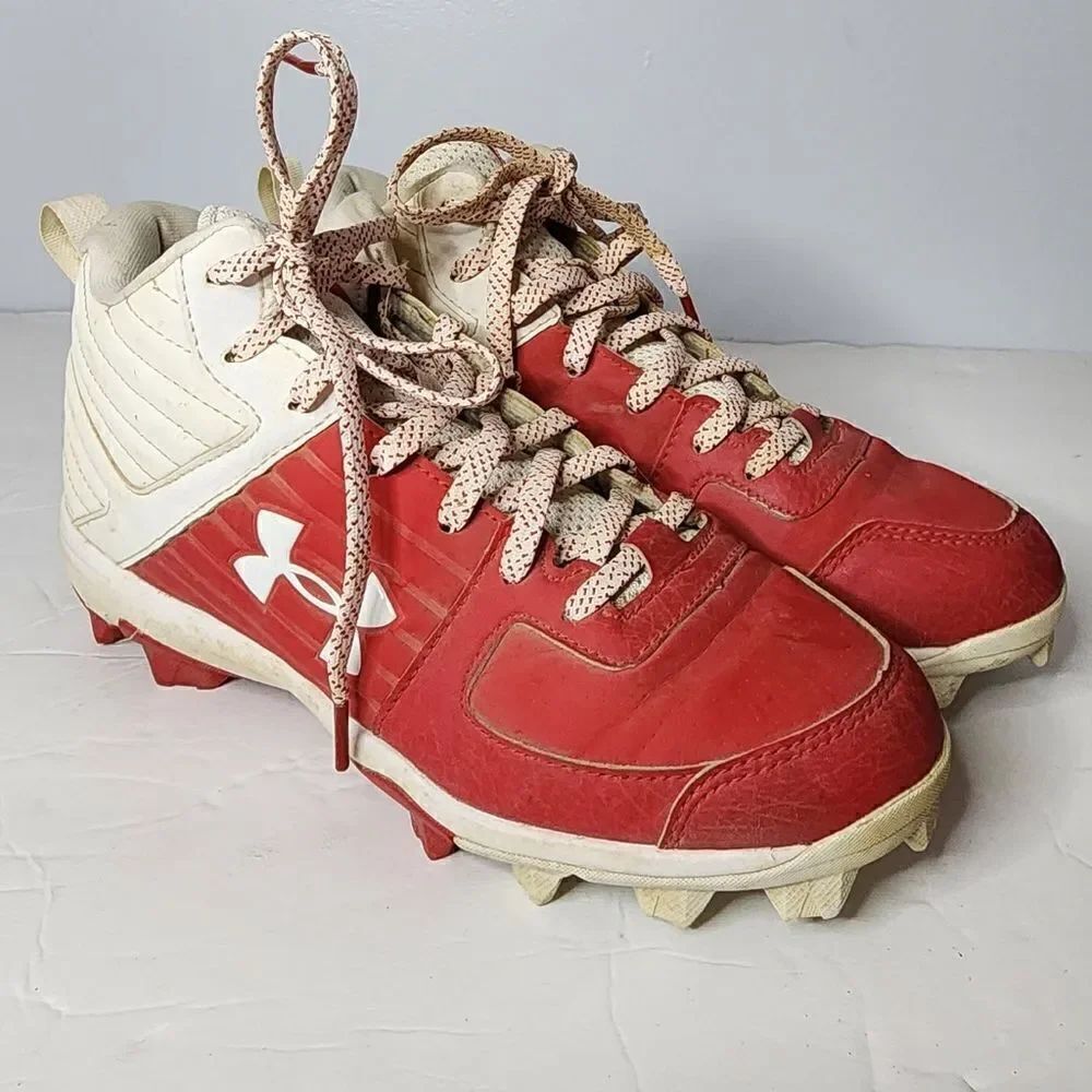 Under Armour football cleats kids size 5Y red and white